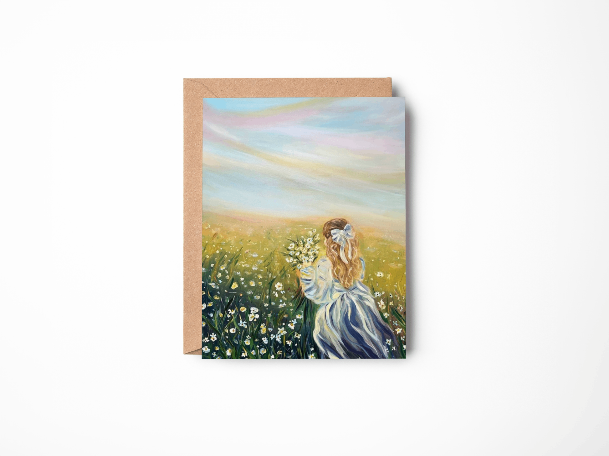 Greeting card with a painting of a woman in a field of flowers on a white background